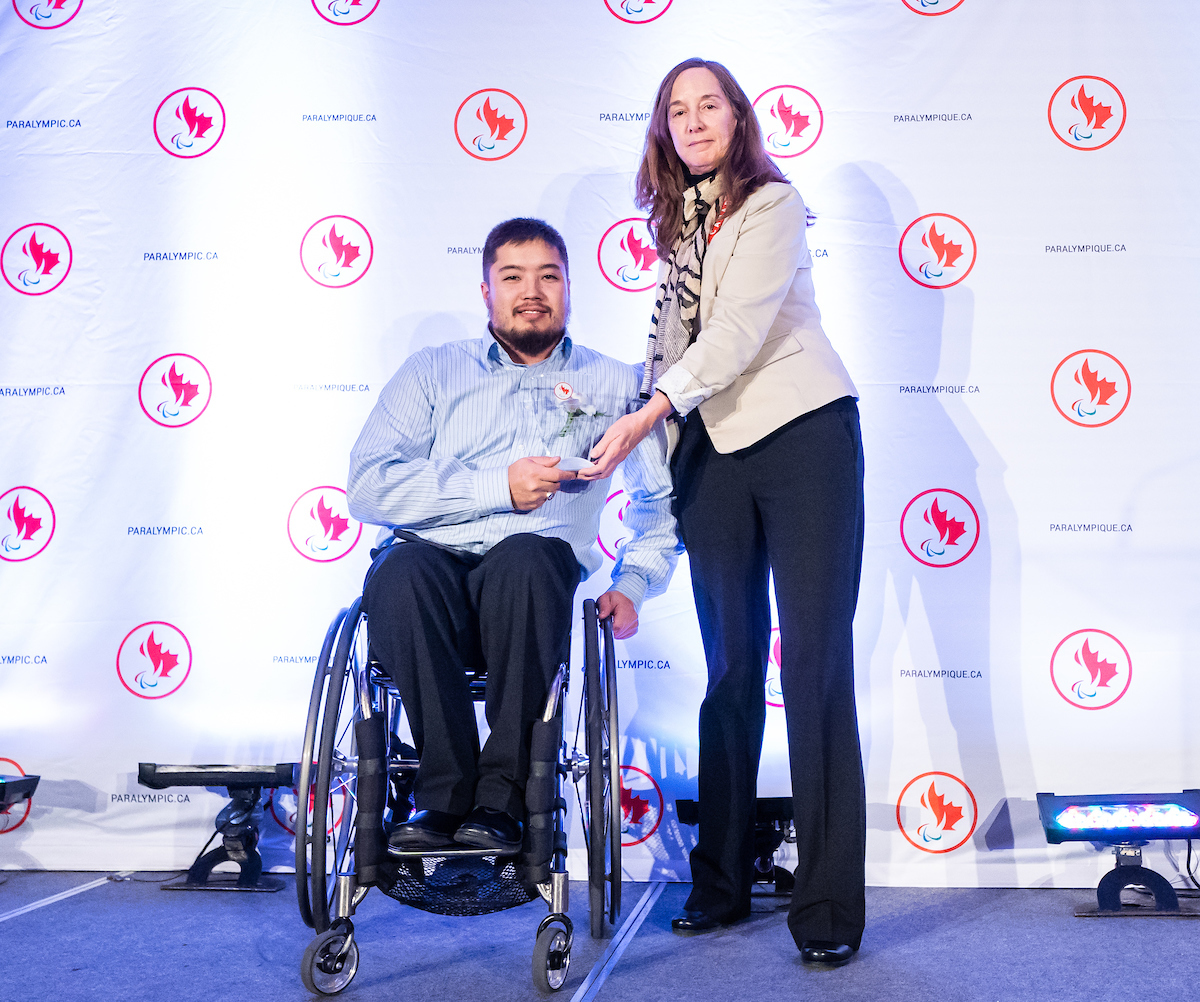 Wheelchair racer Curtis Thom accepting the award on behalf of his late father