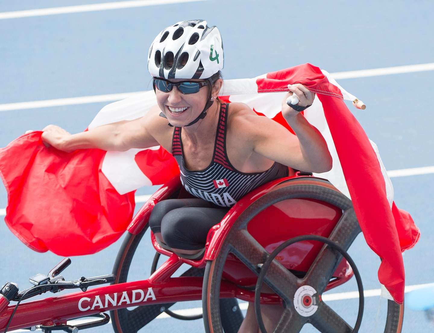 Michelle Stilwell celebrates at Rio 2016 with the Canadian flag