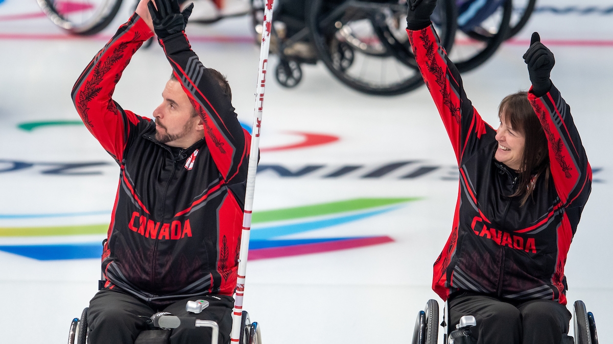 Jon Thurston and Ina Forrest celebrating after advancing into the semifinals of the Beijing 2022 Paralympic Winter Games