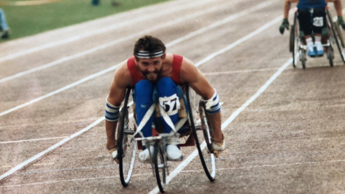 Paralympian Paul Clark competes in a wheelchair race. 
