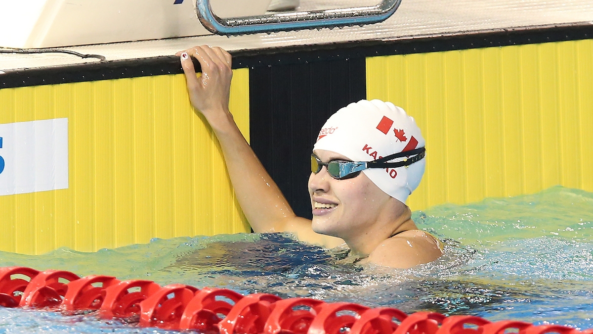 Kirstie Kasko smiling in the pool after a race. 