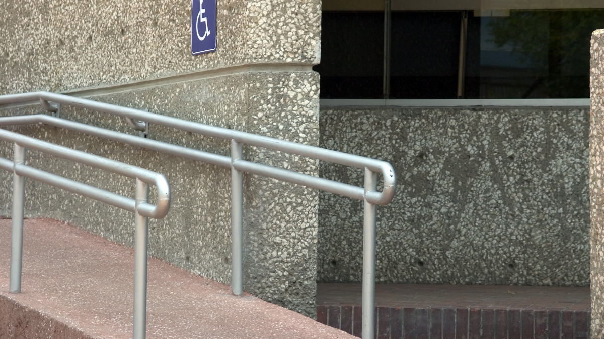 A photo of an accessible ramp outside a building