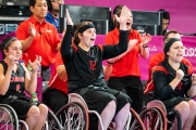 Sandrine in action playing wheelchair basketball