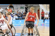 Janet playing wheelchair basketball