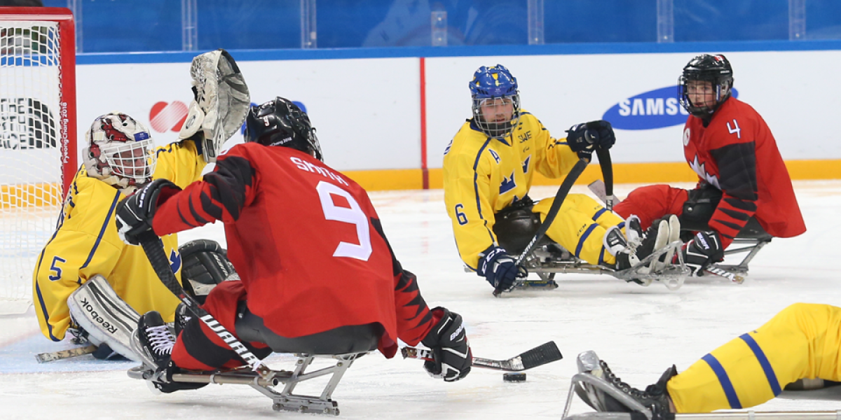 Corbyn Smith on team Canada playing offence against the Swiss