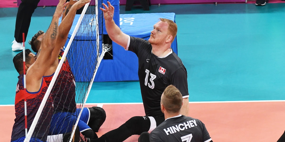 Darek Symonowics competes in a game of sitting volleyball