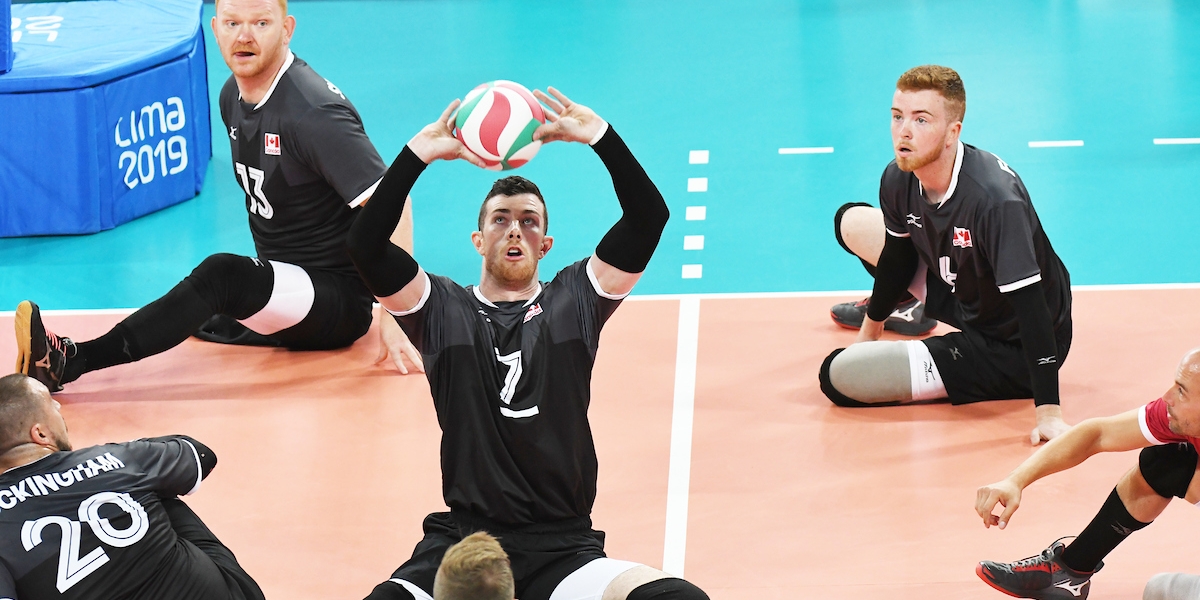Doug Learoyd competes in a game of sitting volleyball