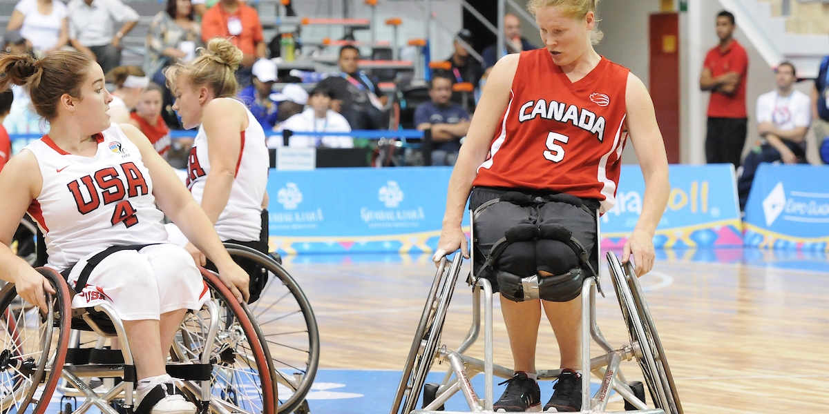 Janet playing wheelchair basketball