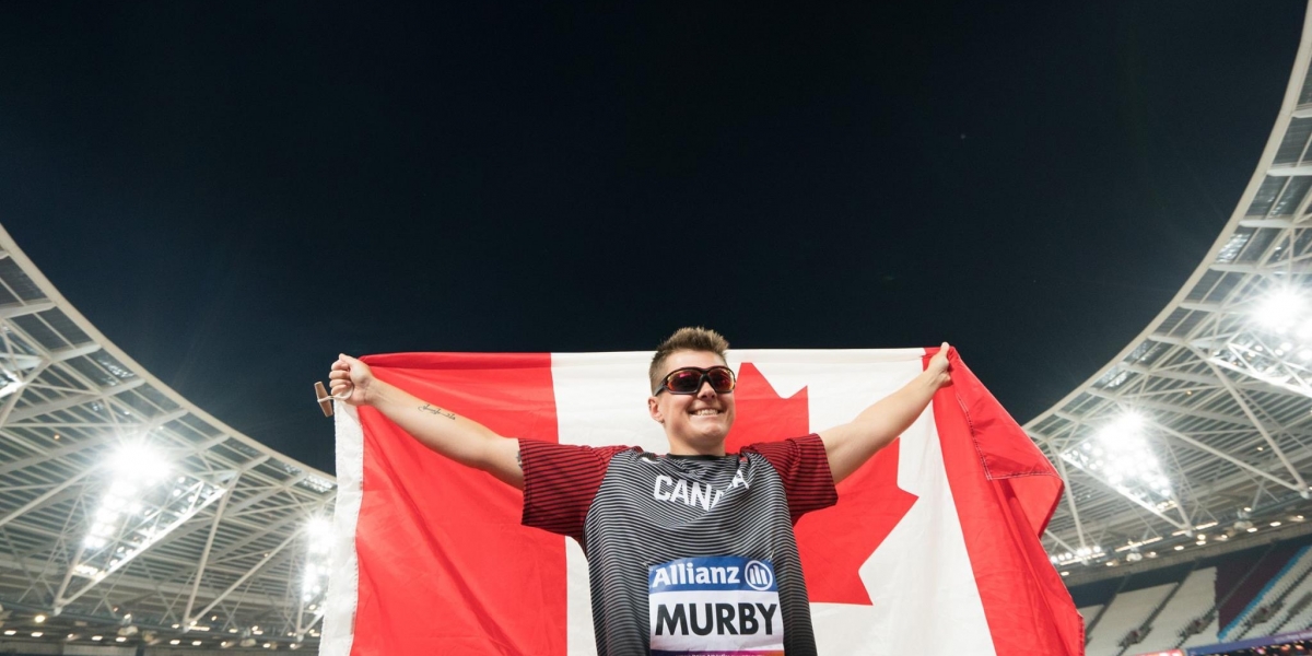 Ness holding the Canadian flag
