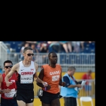 Jason Dunkerley running with his guide in Toronto 2015 