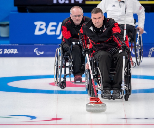 Mark Ideson preparing to take a shot in wheelchair curling 