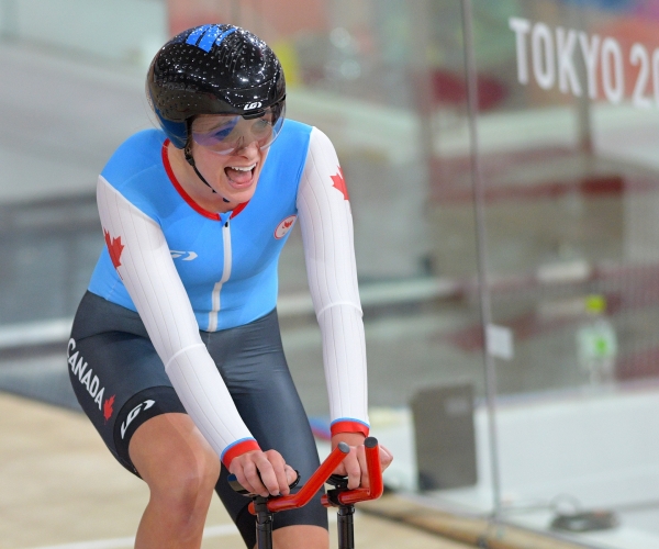 Keely Shaw smiling on her bike after winning bronze in the individual pursuit at Tokyo 2020. 