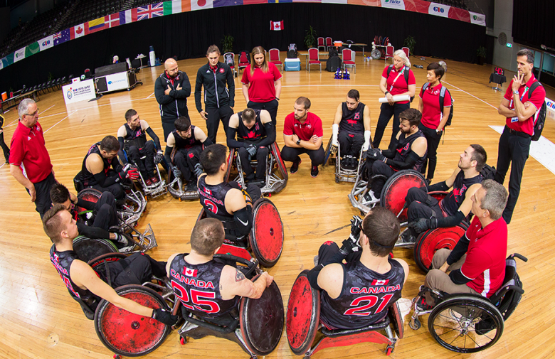 The Canadian wheelchair rugby team in a huddle at the 2018 world championships. 