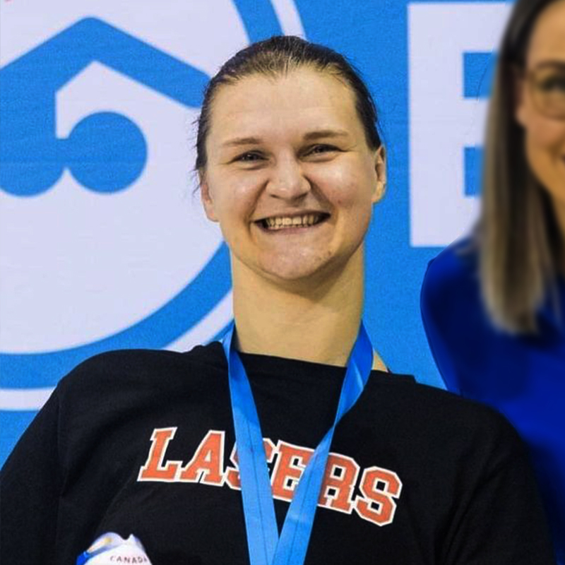 Canadian Para swimmer Nikita Ens poses for a photo following a race where she is smiling with a medal around her neck.