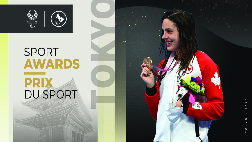 Aurelie Rivard holding up her gold medal on the podium at the Tokyo 2020 Paralympic Games