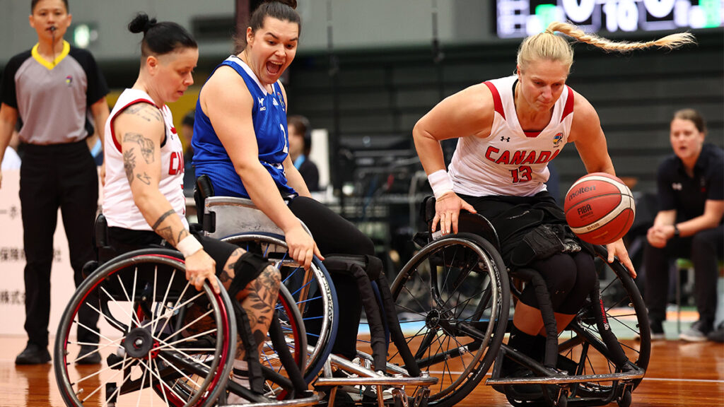 Kady Dandeneau initiates a play for the ball while Cindy Ouellet supports her.