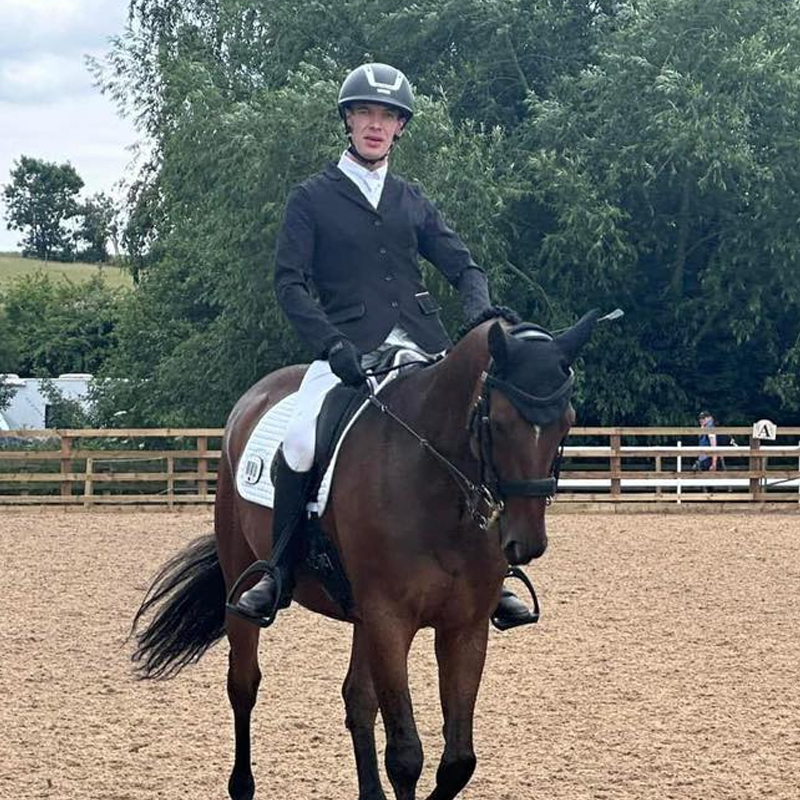 Canadian Para equestrian rider Austen Burns practicing a routine while riding his horse Happy Feet.