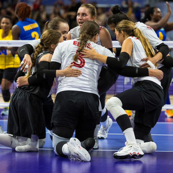 Canada's sitting volleyball team huddled after a point.