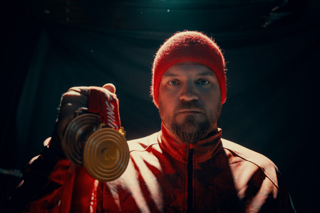 Tyler Turner holding his Paralympic medals